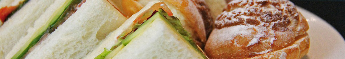 Eating Sandwich Vegan at Localita Plant Based Badasserie restaurant in Los Angeles, CA.